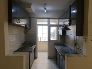 Kitchen in 2 BHK Apartment at Amrapali Silicon City, Sector 76 – for Rent