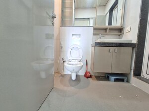 Bathroom in 2 BHK Apartment at Rustomjee Azziano Wing E, Thane West – for Rent