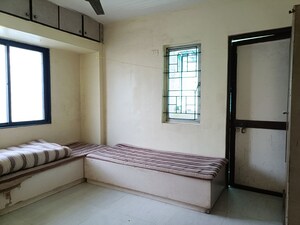 Bedroom in 2 BHK Apartment at Kasturba Housing Society, Vishrantwadi – for Rent
