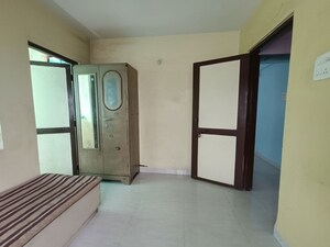 Bedroom in 2 BHK Apartment at Kasturba Housing Society, Vishrantwadi – for Rent