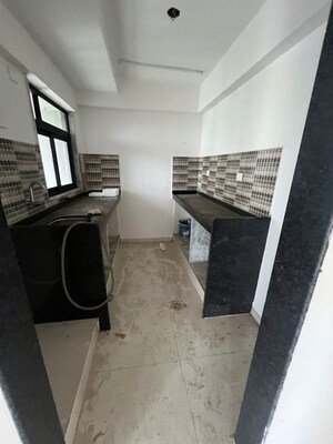 Kitchen in 2 BHK Apartment at Dar Us Salaam CHS, Agripada – for Sale