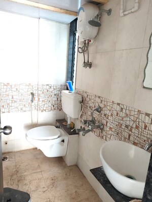 Bathroom in 2 BHK Apartment at Arsiwala Essar Apex, Virar West – for Rent