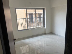 Room in 2 BHK Apartment at Kosmos Express Tower CHS, Borivali West – for Rent