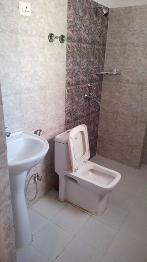 Bathroom in 2 BHK Apartment at Shri Radha Sky Gardens, Sector 16b Greater Noida – for Rent