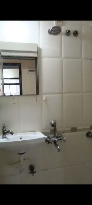 Bathroom in 1 BHK Apartment at Dheeraj Solitaire, Malad West – for Rent