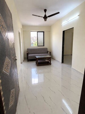Living Room in 1 BHK Apartment at Navgharkul CHS, Sector 48a Nerul – for Rent
