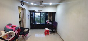 Living Room in 1 BHK Apartment at Mangalmurti Twinkle Residency, Ghansoli Sector 21 – for Rent
