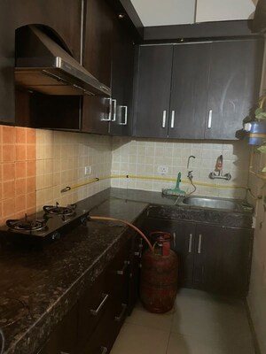 Kitchen in 3 BHK Apartment at Uninav Heights Phase I, Raj Nagar Extension – for Rent