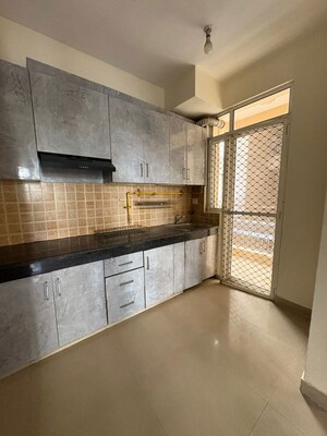 Kitchen in 2.5 BHK Apartment at Mahagun Mywoods, Sector 16c Greater Noida – for Rent