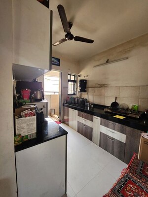 Kitchen in 2 BHK Apartment at DSK Meghmalhar Phase I, Sinhagad Road – for Rent
