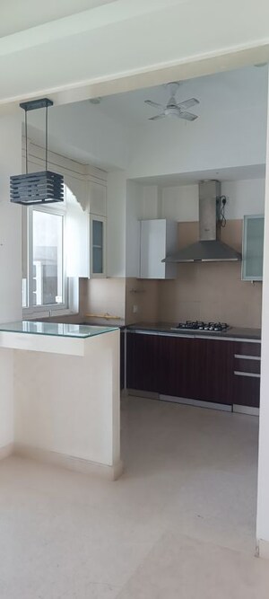 Kitchen in 3.5 BHK Apartment at Puri Diplomatic Greens Phase I, Sector 111 – for Rent