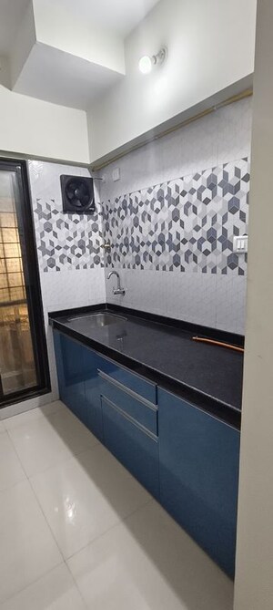 Kitchen in 1 BHK Apartment at Raunak Unnathi Woods Phase 7 A And B, Ghodbunder Road – for Rent