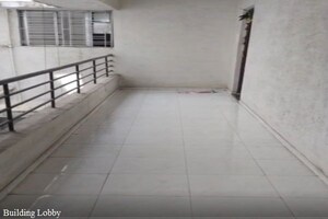 Building Lobby in 1 BHK Apartment at Wadgaon Sheri – for Rent