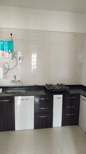 Kitchen in 2 BHK Apartment at Ravinanda Skylights, Wagholi – for Rent