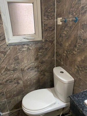Bathroom in 2 BHK Apartment at Shri Radha Sky Gardens, Sector 16b Greater Noida – for Rent