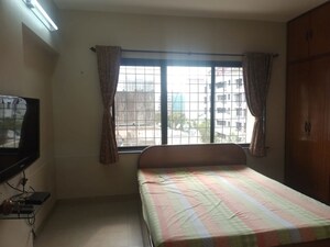 Bedroom in 2 BHK Apartment at Sangam CHS, Goregaon East – for Rent