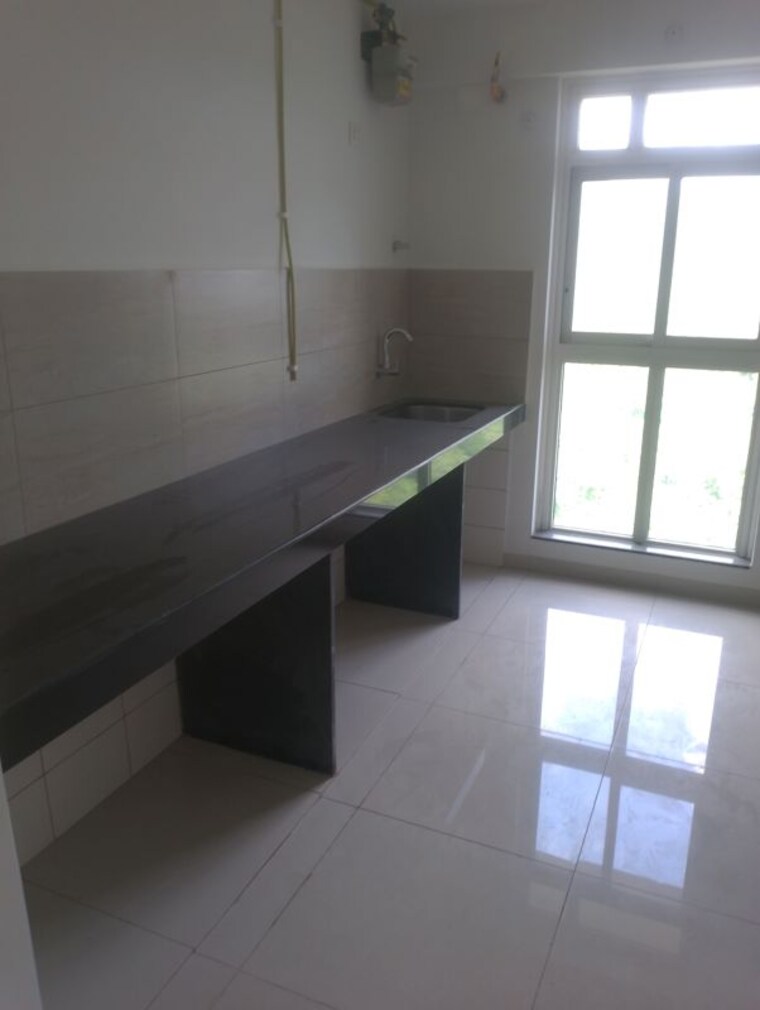 Kitchen, godrej-emerald 3 Bedroom 908 Sq.Ft. Apartment In Ghodbunder Road Thane 10667113