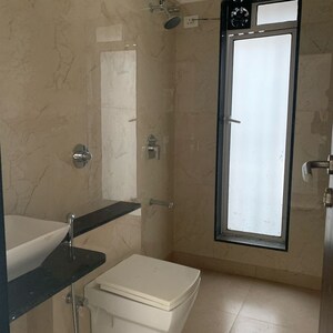 Bathroom in 2 BHK Apartment at Axiom Girdhar Apartment, Kastur Park – for Sale