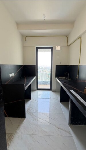 Kitchen in 3 BHK Apartment at Raymond The Address, Pokhran Road No Two – for Rent