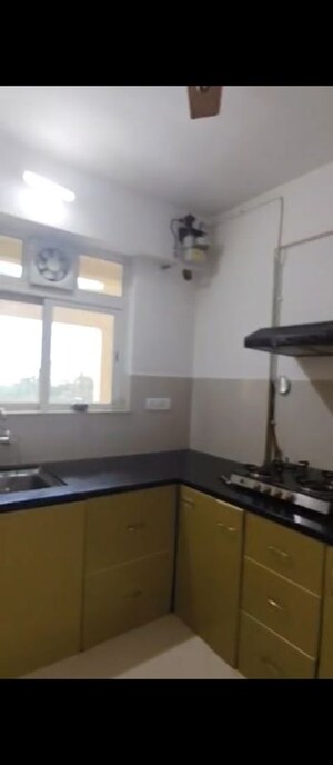 Kitchen in 2 BHK Apartment at Swastik Regalia, Waghbil – for Rent