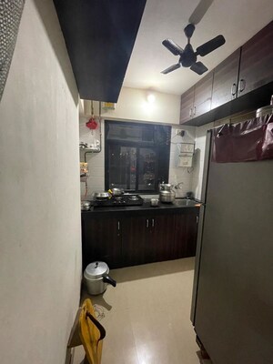 Kitchen in 1 BHK Apartment at Raunak Heights, Ghodbunder Road – for Sale