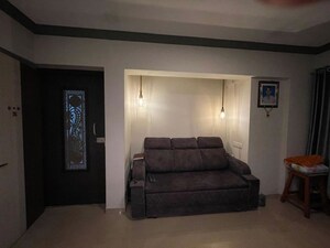 Living Room in 1 BHK Apartment at Raunak Heights, Ghodbunder Road – for Sale