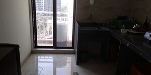 Kitchen in 3 BHK Apartment at Harmony Sky Suites, Ghodbunder Road – for Rent