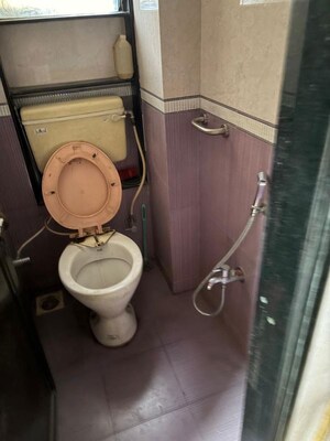 Bathroom in 2 BHK Apartment at Tulip Park CHS, Andheri East – for Rent