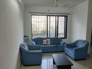 Living Room in 2 BHK Apartment at Swastik Regalia, Waghbil – for Rent