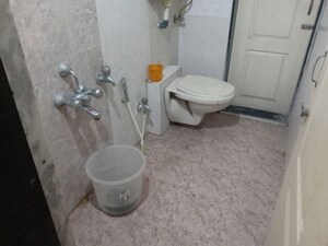 Bathroom in 2 BHK Apartment at Swastik Regalia, Waghbil – for Rent