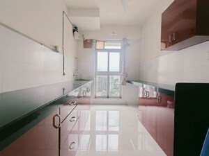 Kitchen in 2 BHK Apartment at Godrej Emerald, Ghodbunder Road – for Rent