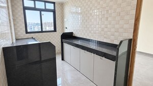 Kitchen in 2 BHK Apartment at Dhanlaxmi Dhananjay Hill View, Nalasopara West – for Sale