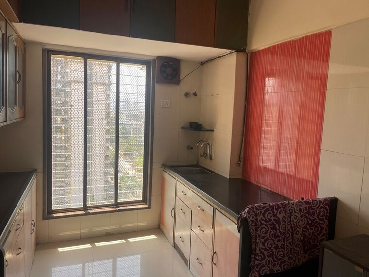 Kitchen, serenity-chs-ltd 2 Bedroom 980 Sq.Ft. Apartment In Mira Road Thane 10668378
