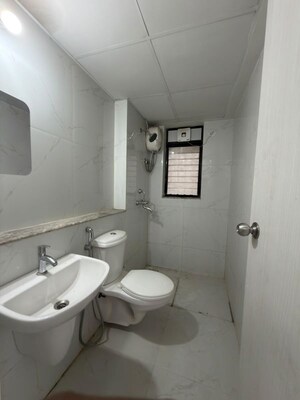 Bathroom in 1 BHK Apartment at Runwal Gardens, Dombivli East – for Rent