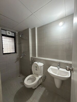 Bathroom in 1 BHK Apartment at Runwal Gardens, Dombivli East – for Rent