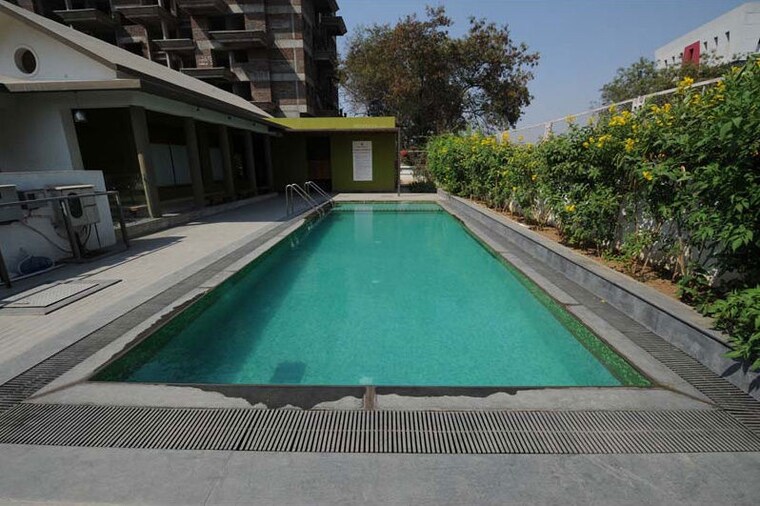 Swimming Pool, kumar-palmspring-towers 3 Bedroom 1500 Sq.Ft. Apartment In Undri Pune 10669102