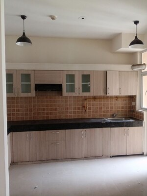 Kitchen in 3 BHK Apartment at Mahagun My Woods, Sector 16c Greater Noida – for Rent