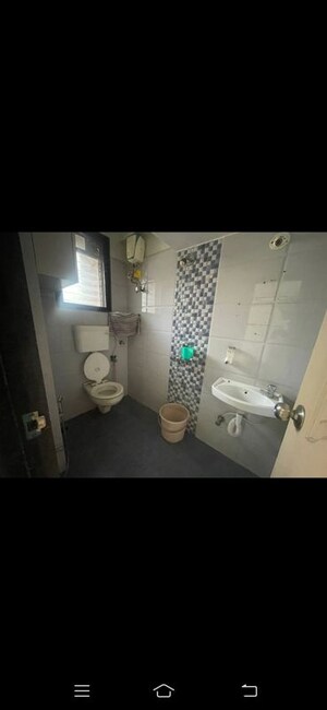Bathroom in 2 BHK Apartment at Ojass Mayuresh CHS, Naupada – for Rent