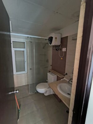 Bathroom in 3 BHK Apartment at Mahagun Moderne, Sector 78 – for Sale