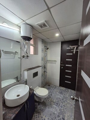 Bathroom in 3 BHK Apartment at Gaur Sportswood, Sector 79 – for Rent