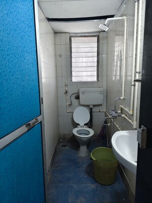 Bathroom in 2 BHK Apartment at Seva Samiti CHS, Sion East – for Rent