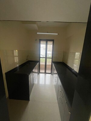 Kitchen in 2 BHK Apartment at Hubtown Greenwoods, Vartak Nagar – for Rent