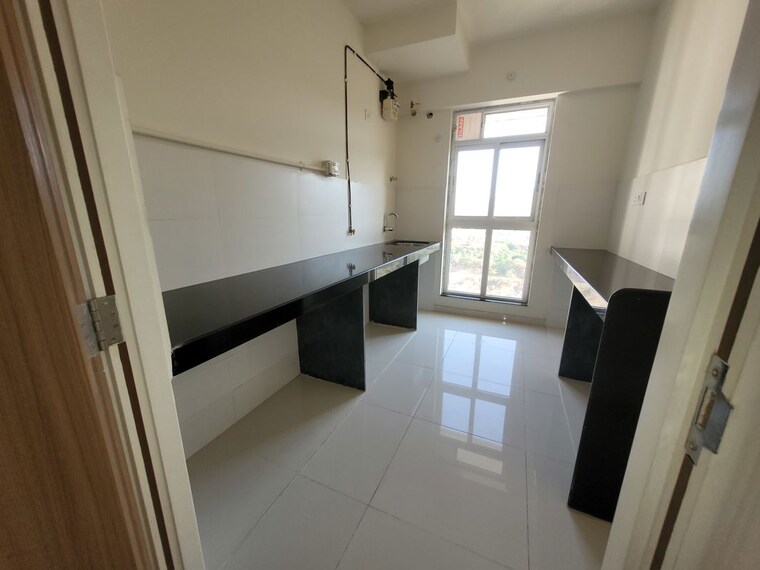 Kitchen, godrej-emerald 2 Bedroom 708 Sq.Ft. Apartment In Ghodbunder Road Thane 10670835