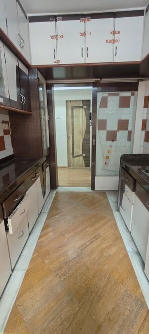 Kitchen in 2 BHK Apartment at Eden Woods complex, Manpada – for Rent