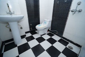 Bathroom in 2 BHK Apartment at Meenal Balmukund Residency, Raj Nagar Extension – for Sale