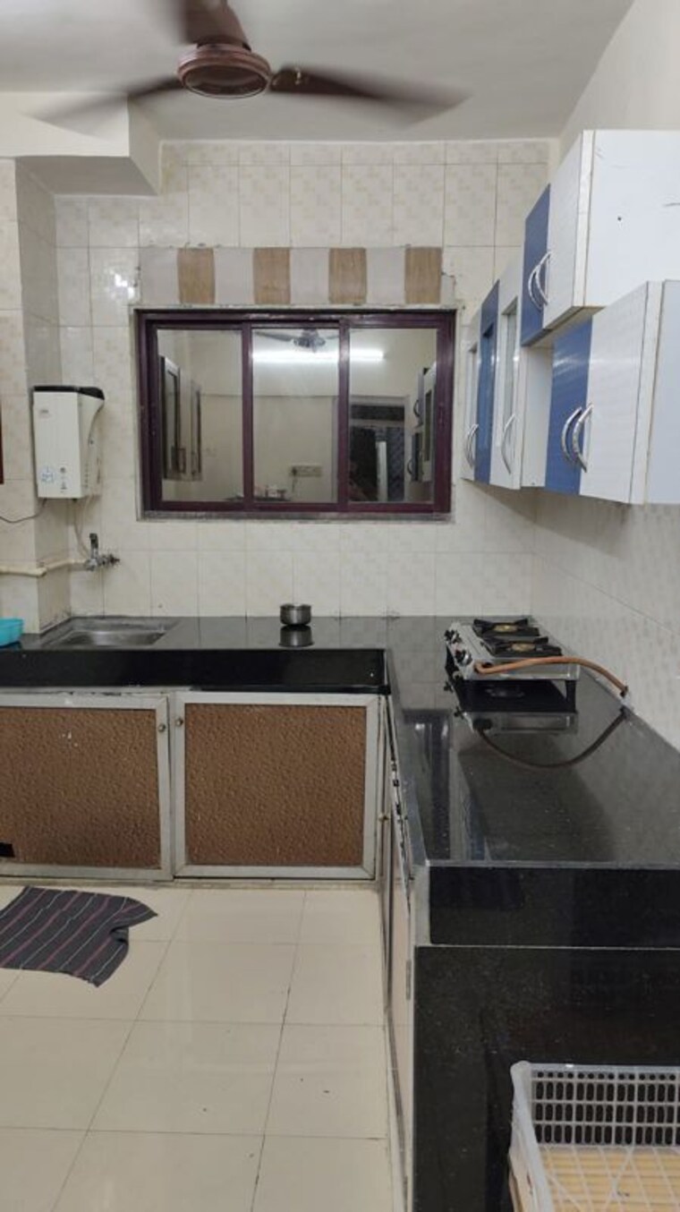Kitchen, nirman-kutir 2 Bedroom 1100 Sq.Ft. Apartment In Yari Road Mumbai 10671187