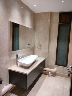 Bathroom in 4 BHK Apartment at Vasant Vihar – for Rent