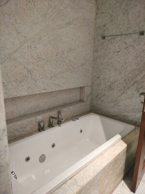 Bathroom in 4 BHK Apartment at Vasant Vihar – for Rent