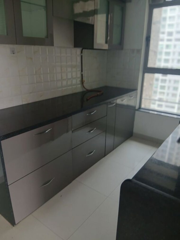 Kitchen, kalpataru-immensa 3 Bedroom 944 Sq.Ft. Apartment In Kolshet Road Thane 10671484