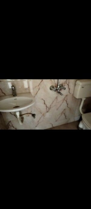 Bathroom in 2 BHK Apartment at Buttercup CHS, Ambernath West – for Sale